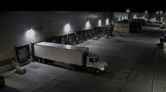 Logistics warehouse loading dock at night